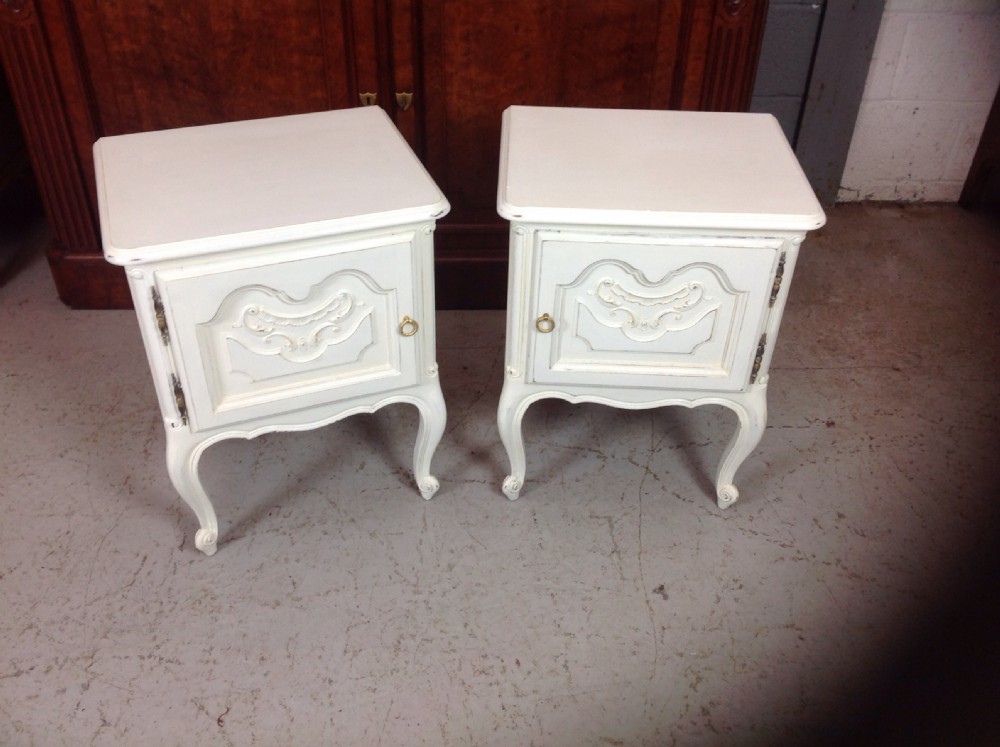 pair of painted french bedside cabinets