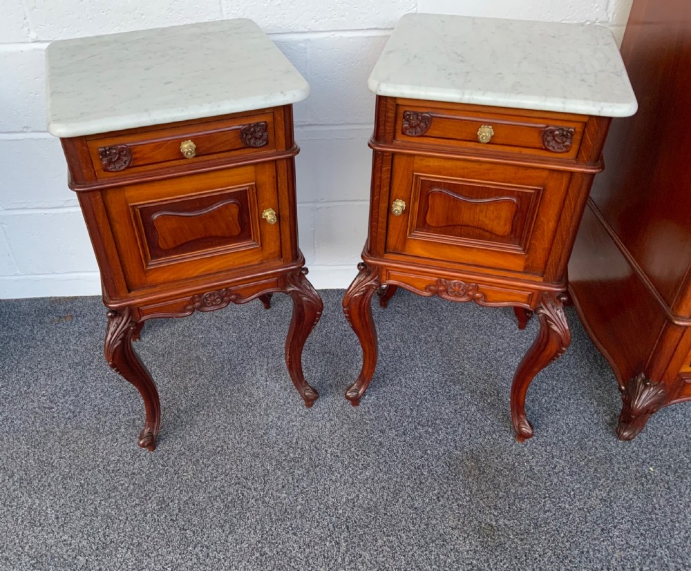 pair of french mahogany bedside cabinets