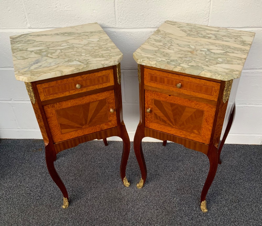 pair of french inland bedside cabinets