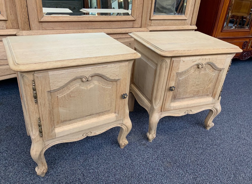 pair of bleached oak french bedside cabinets