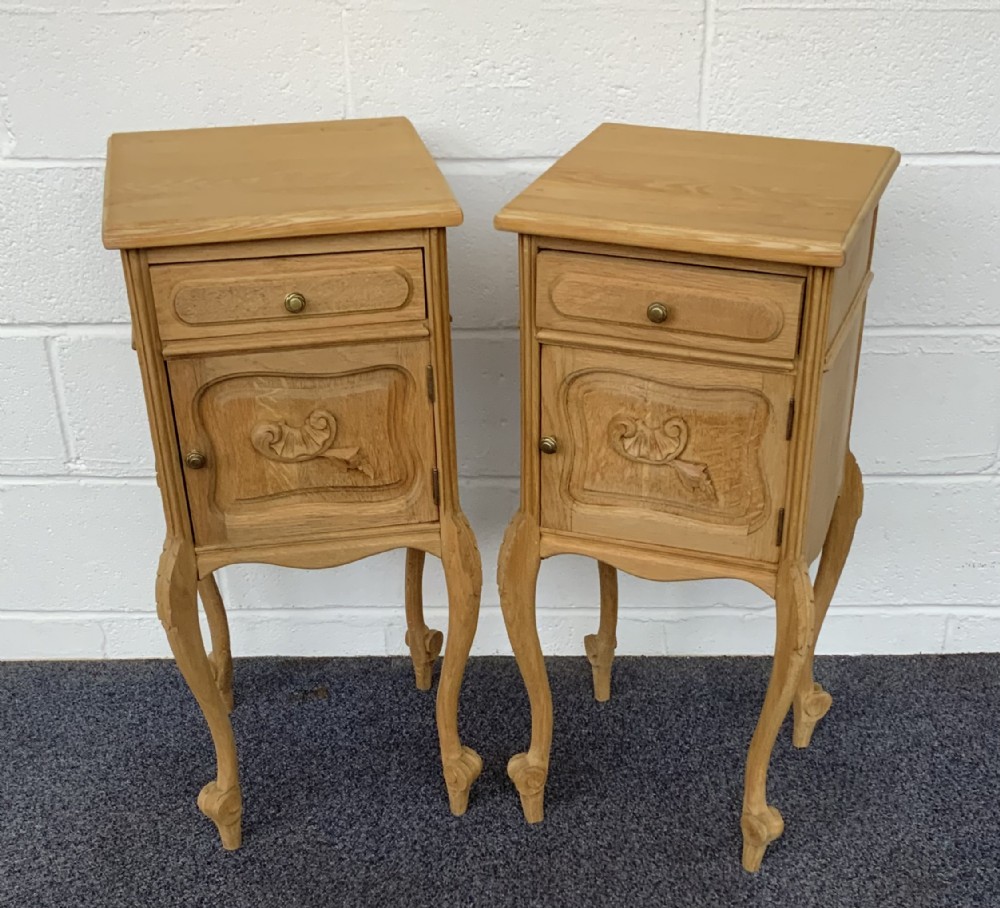 pair of bleached oak bedside cabinets