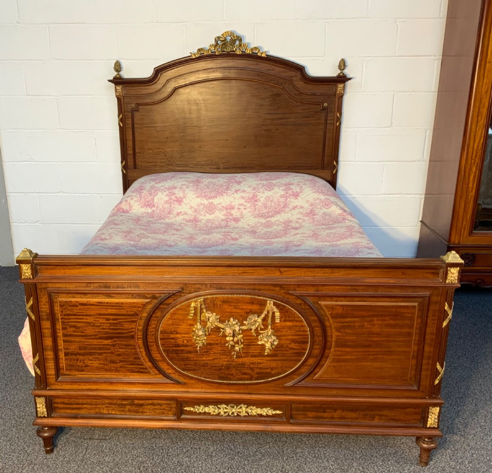 impressive king size french bed with brass detailing