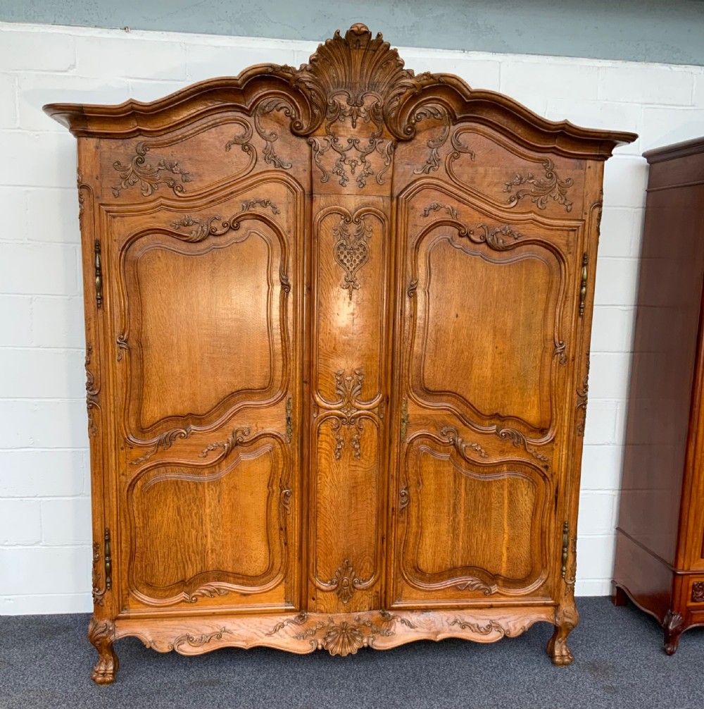 stunning carved oak armoire of grand proportions