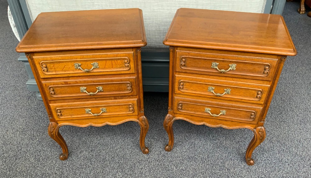 pair of golden oak french bedside cabinets